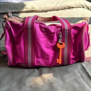 Fossil Vibrant Pink Duffel Bag with Orange Key Charm